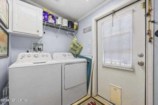 washroom featuring a healthy amount of sunlight, cabinets, independent washer and dryer, crown molding, and a textured ceiling