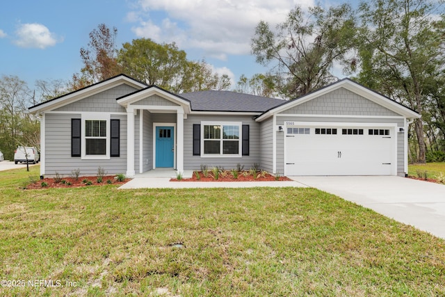 single story home with a front yard and a garage