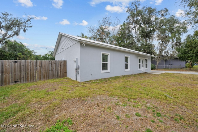 rear view of house with a lawn