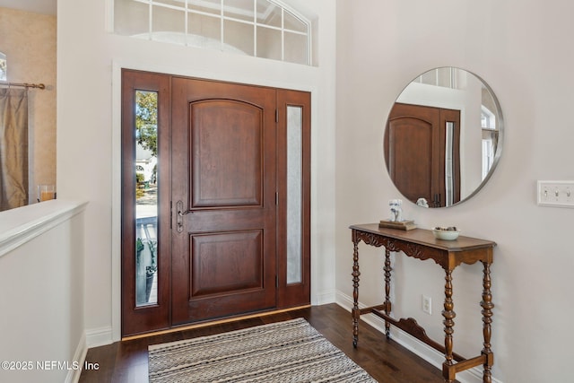 foyer entrance featuring dark hardwood / wood-style flooring