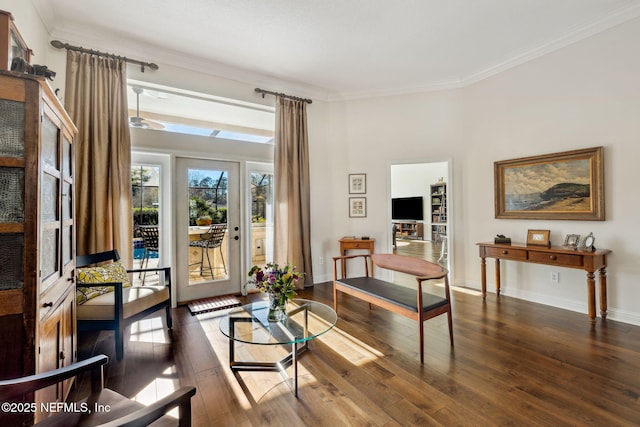 sitting room featuring crown molding and dark hardwood / wood-style floors