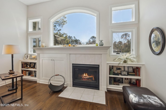 living room with a fireplace and dark hardwood / wood-style flooring