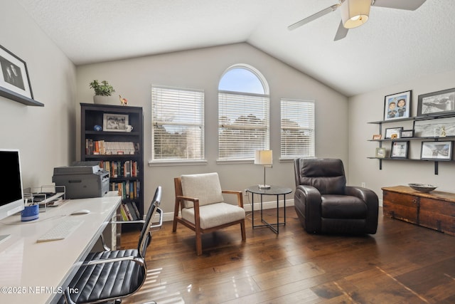 office area with vaulted ceiling, dark hardwood / wood-style floors, a textured ceiling, and ceiling fan