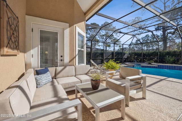 view of patio / terrace featuring an outdoor living space and glass enclosure