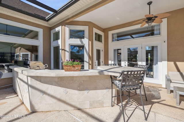 view of patio / terrace featuring a bar and ceiling fan