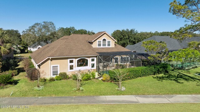 view of front of home featuring a lanai and a front lawn