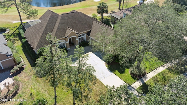 birds eye view of property with a water view