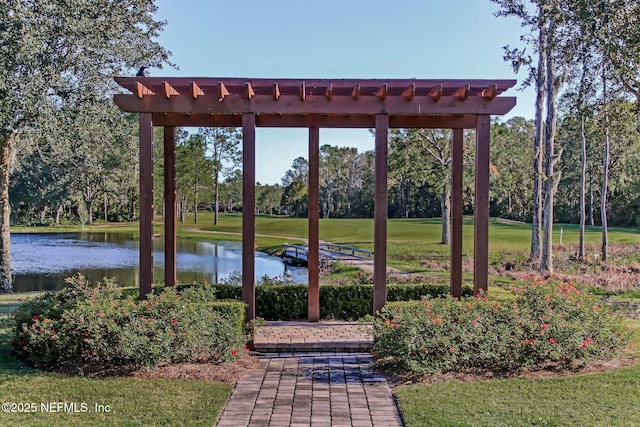 view of home's community with a water view and a lawn