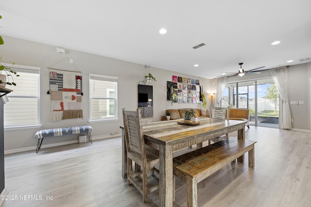 dining area featuring light hardwood / wood-style floors and ceiling fan