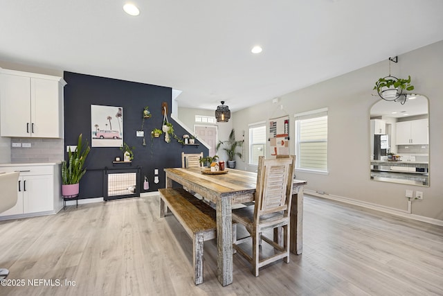 dining space with light wood-type flooring