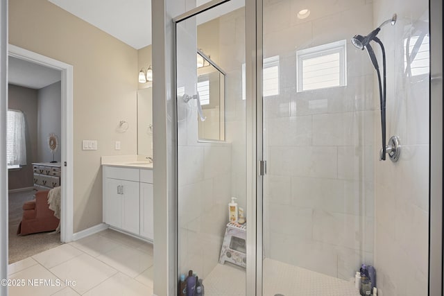 bathroom featuring tile patterned floors, vanity, and an enclosed shower