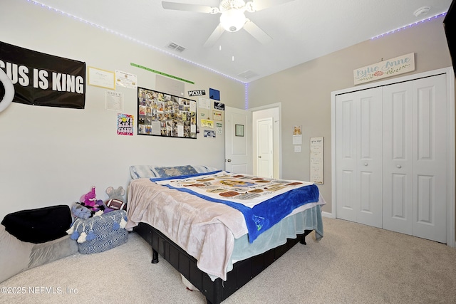 bedroom with ceiling fan, a closet, and carpet floors