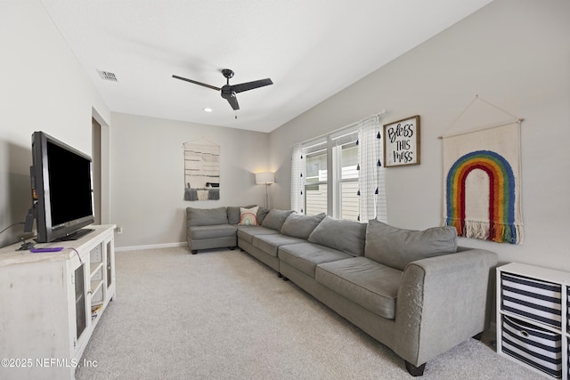 living room with ceiling fan and light carpet