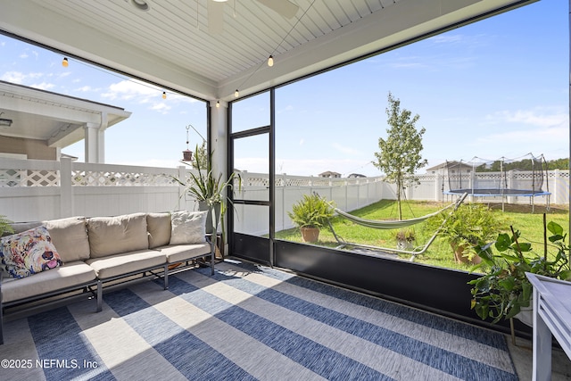 sunroom / solarium with plenty of natural light and wood ceiling