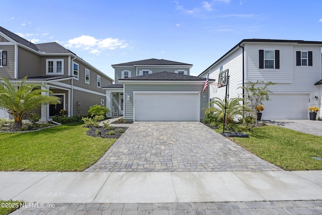 view of front of house featuring a garage and a front lawn