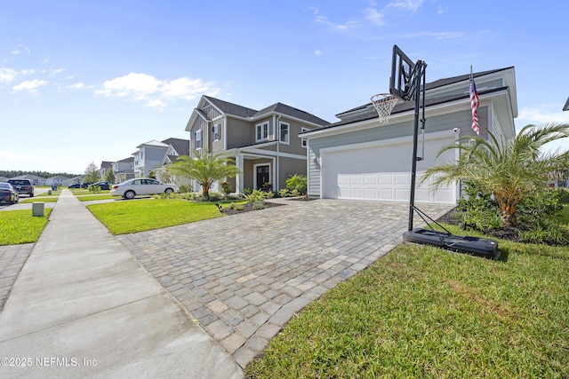 view of front of property featuring solar panels, a garage, and a front yard