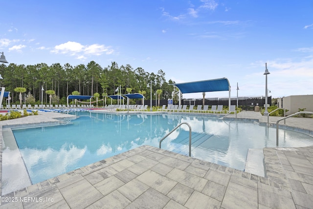 view of swimming pool with a patio area