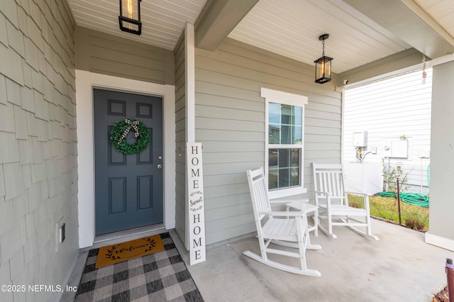 doorway to property featuring covered porch