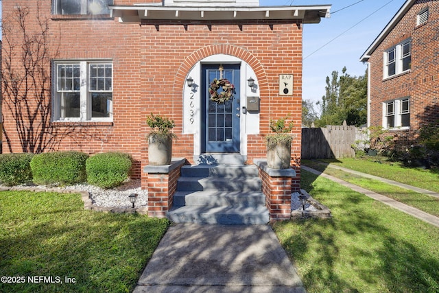 entrance to property with a yard