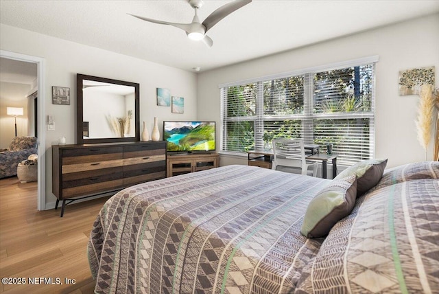 bedroom featuring light wood-type flooring and ceiling fan