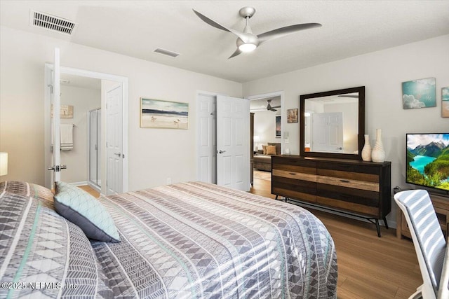 bedroom with ceiling fan and wood-type flooring