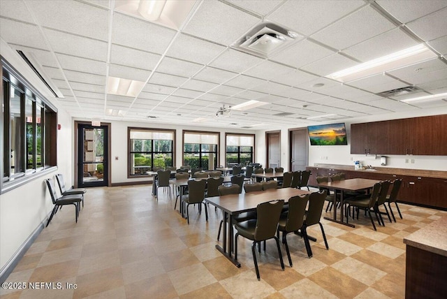 dining room featuring a paneled ceiling and ceiling fan