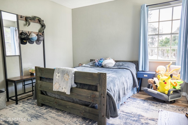 bedroom with wood-type flooring