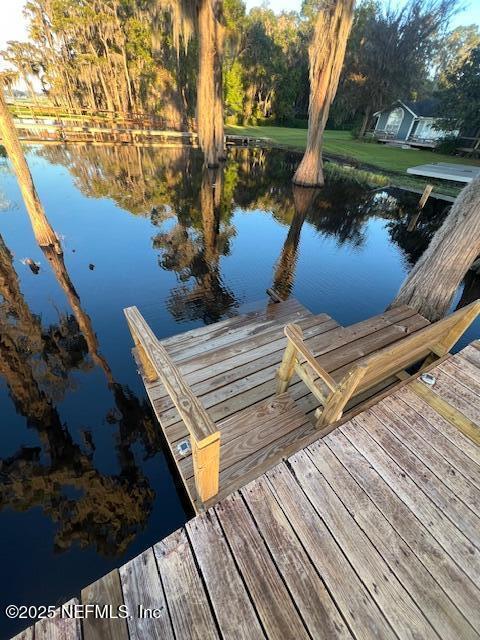 dock area featuring a water view