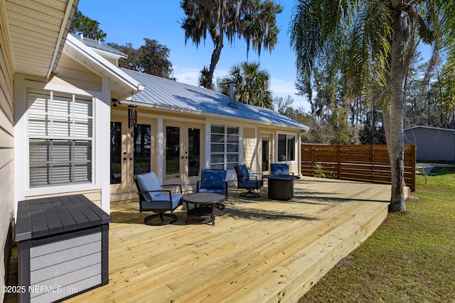 wooden deck featuring french doors