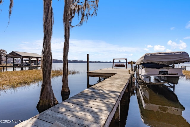 dock area featuring a water view and boat lift