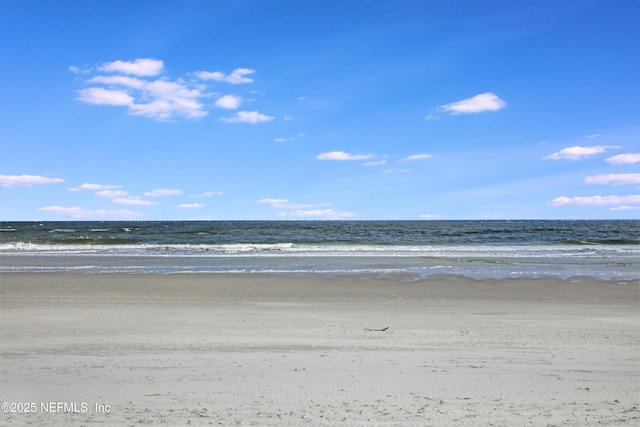 view of water feature with a beach view