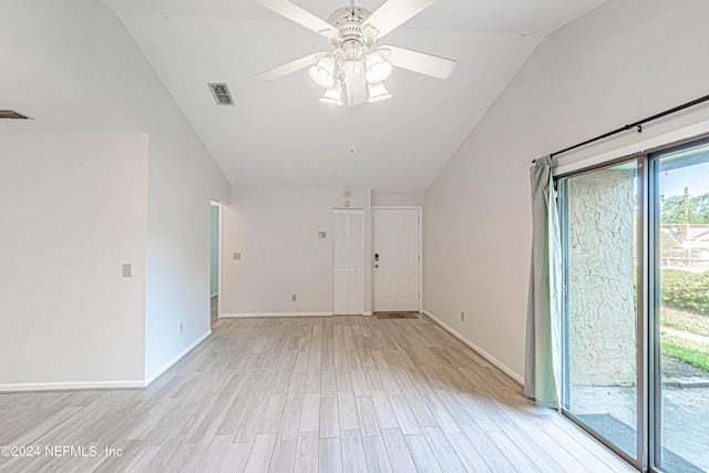 empty room featuring light hardwood / wood-style flooring, ceiling fan, and lofted ceiling