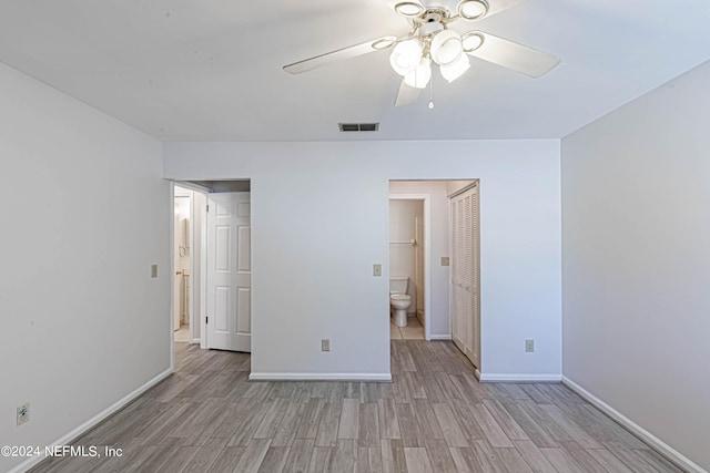 unfurnished bedroom featuring light wood-type flooring, a closet, and ceiling fan