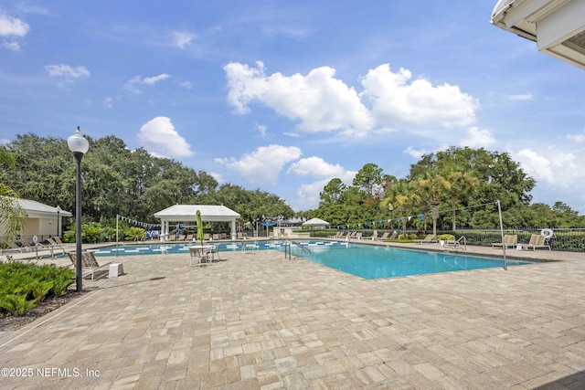 view of swimming pool with a patio area