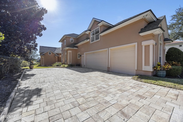 view of side of property with a garage