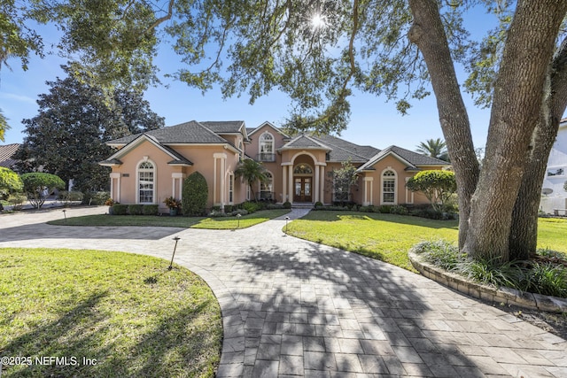 view of front of home with a front lawn