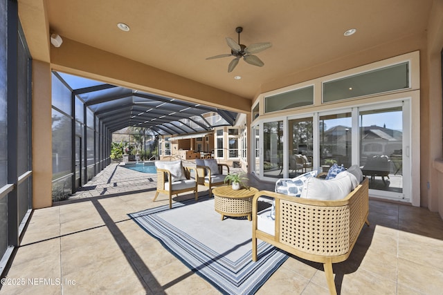 view of patio / terrace featuring ceiling fan and glass enclosure