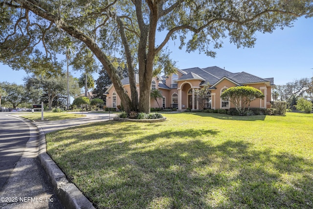 view of front of home with a front yard