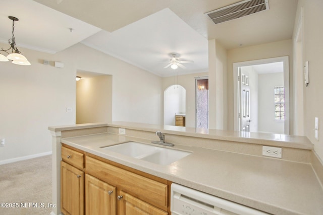 kitchen featuring light colored carpet, crown molding, ceiling fan, pendant lighting, and sink