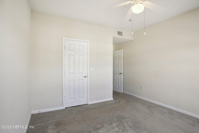 unfurnished bedroom featuring ceiling fan and carpet