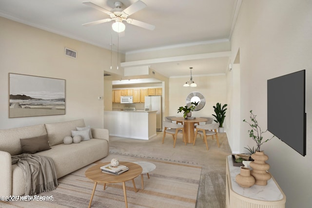 living room featuring light colored carpet, ceiling fan, and crown molding