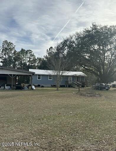 exterior space with a front yard