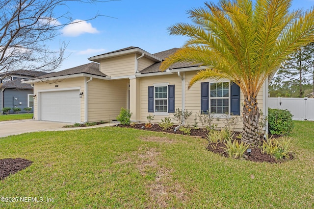 view of front of house featuring a front lawn and a garage