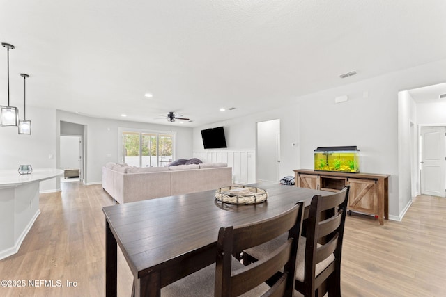 dining area featuring ceiling fan and light hardwood / wood-style floors