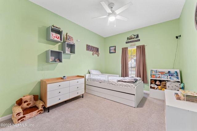 carpeted bedroom featuring ceiling fan