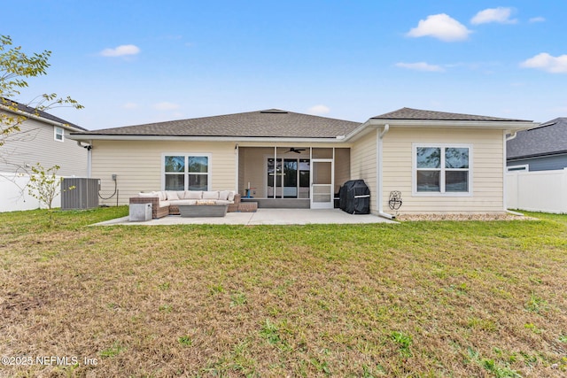 rear view of house with a lawn, outdoor lounge area, ceiling fan, central AC, and a patio area