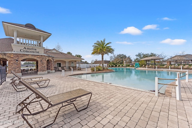 view of swimming pool with a patio area