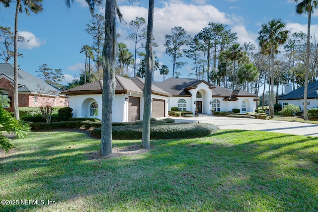 ranch-style house with a front yard and a garage