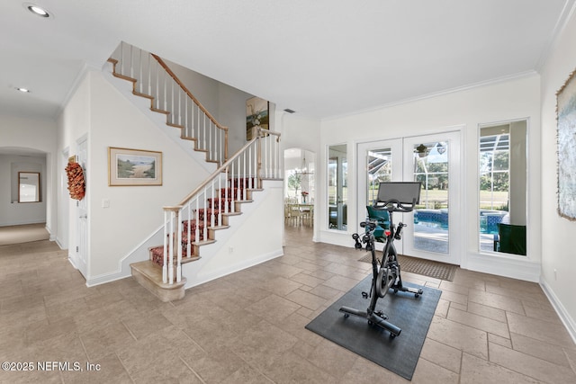 exercise room with french doors and ornamental molding