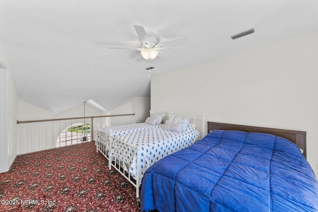 bedroom with carpet flooring, ceiling fan, and lofted ceiling